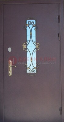 Металлическая дверь со стеклом и ковкой ДСК-77 в панельный дом в Климовске